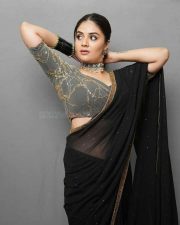 Sexy Sreemukhi in a Black Transparent Saree Photos 01