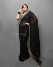 Sexy Sreemukhi in a Black Transparent Saree Photos 02