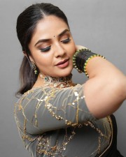 Sexy Sreemukhi in a Black Transparent Saree Photos 05