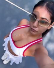 Stylish Actress Radhika Seth in a White Red Sports Crop Top Photos 01