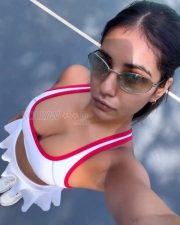 Stylish Actress Radhika Seth in a White Red Sports Crop Top Photos 02