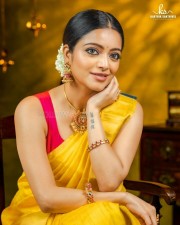 Actress Janani Iyer in a Traditional Yellow Saree Photoshoot Pictures 01