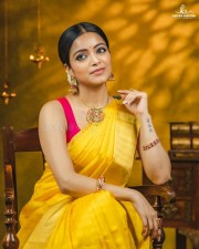 Actress Janani Iyer in a Traditional Yellow Saree Photoshoot Pictures 04