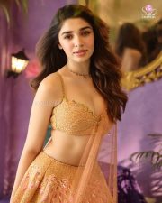 Actress Krithi Shetty in a Sleeveless Peach Embellished Lehenga with a Flared Skirt Photos 01 Actress Krithi Shetty in a Sleeveless Peach Embellished Lehenga with a Flared Skirt Photos 01