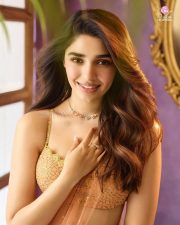 Actress Krithi Shetty in a Sleeveless Peach Embellished Lehenga with a Flared Skirt Photos 03 Actress Krithi Shetty in a Sleeveless Peach Embellished Lehenga with a Flared Skirt Photos 03