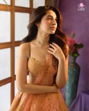 Actress Krithi Shetty in a Sleeveless Peach Embellished Lehenga with a Flared Skirt Photos 04