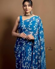 Actress Varshini Sounderajan in a Blue Floral Printed Saree with a Sleeveless Blouse Photos 01