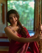 Beautiful Telugu Actress Krithi Shetty in a Maroon Red Silk Saree with a Cream Sleeveless Blouse Pictures 01