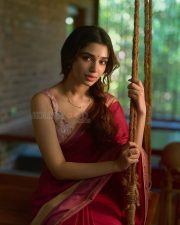 Beautiful Telugu Actress Krithi Shetty in a Maroon Red Silk Saree with a Cream Sleeveless Blouse Pictures 04
