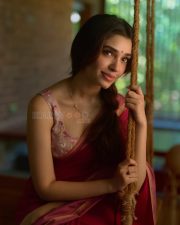 Beautiful Telugu Actress Krithi Shetty in a Maroon Red Silk Saree with a Cream Sleeveless Blouse Pictures 08