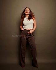 Bollywood Diva Kareena Kapoor Khan in a White Tank Top and Dark Brown High Waist Pants Photos 01
