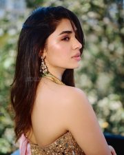 Breathtaking Actress Krithi Shetty in a Gold Mirror Work Lehenga Photos 01