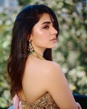 Breathtaking Actress Krithi Shetty in a Gold Mirror Work Lehenga Photos 01