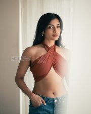 Charming Actress Ashna Zaveri in a Rust Crossover Halter Crop Top and Denim Jeans Photos 01