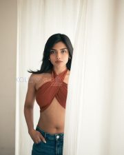 Charming Actress Ashna Zaveri in a Rust Crossover Halter Crop Top and Denim Jeans Photos 02
