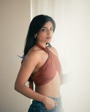 Charming Actress Ashna Zaveri in a Rust Crossover Halter Crop Top and Denim Jeans Photos 03