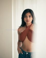 Charming Actress Ashna Zaveri in a Rust Crossover Halter Crop Top and Denim Jeans Photos 05