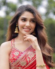 Cute Actress Krithi Shetty in a Vibrant Red Saree with Gold and Red Border Pictures 03