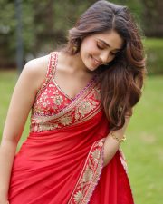 Cute Actress Krithi Shetty in a Vibrant Red Saree with Gold and Red Border Pictures 04