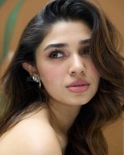 Dazzling Actress Krithi Shetty in a Black Strapless Corset Bustier with a Navy Blue Pleated Mini Skirt Photos 01