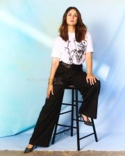 Elegant Bollywood Actress Kareena Kapoor Khan in a White Abstract Printed T Shirt with Black Striped Pants Photos 01