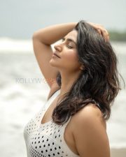 Enchanting Actress Varshini Sounderajan in a White Crochet Mini Dress Photos 01