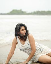 Enchanting Actress Varshini Sounderajan in a White Crochet Mini Dress Photos 04
