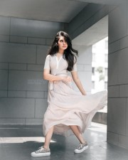 Radiant Beauty Krithi Shetty in a Cream Coloured Top with Matching Skirt and Pink Lipstick Photos 05