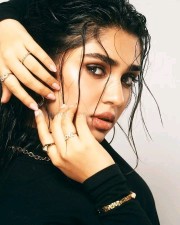 Sexy Krithi Shetty in a Black Dress Wet Look Photos 01