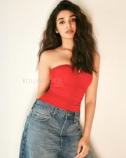 Sexy Krithi Shetty in a Red Strapless Top and Denim Jeans Pictures 08
