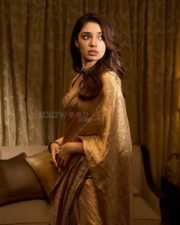 South Indian Actress Krithi Shetty in a Golden Saree with a Matching Designer Blouse Photos 03