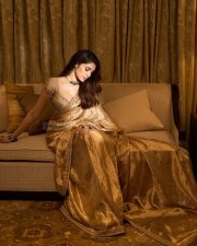 South Indian Actress Krithi Shetty in a Golden Saree with a Matching Designer Blouse Photos 04