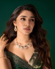 Striking Actress Krithi Shetty in a Dark Green Sequin Lehenga Photos 01