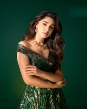 Striking Actress Krithi Shetty in a Dark Green Sequin Lehenga Photos 02