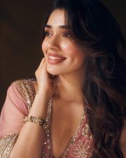 Striking Actress Krithi Shetty in a dusty rose embellished saree with gold jewelry photos 12