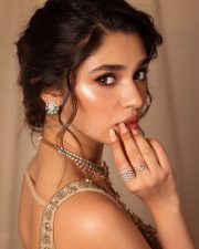 Stunning Krithi Shetty in a Golden Saree and Sleeveless Blouse Photos 01