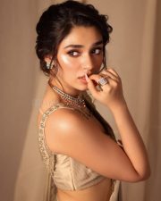 Stunning Krithi Shetty in a Golden Saree and Sleeveless Blouse Photos 02
