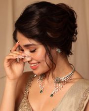 Stunning Krithi Shetty in a Golden Saree and Sleeveless Blouse Photos 07