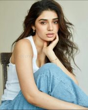 Stunning Krithi Shetty in a White Tank Top and Blue Jeans Photos 04