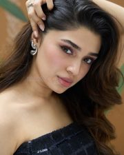 Stylish Krithi Shetty in a Black Strapless Mini Dress Pictures 02