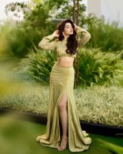 Stylish Krithi Shetty in a Shimmering Lime Green Co Ord Set with a Thigh Slit Skirt and High Neck Long Sleeve Top Photos 02