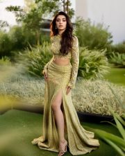 Stylish Krithi Shetty in a Shimmering Lime Green Co Ord Set with a Thigh Slit Skirt and High Neck Long Sleeve Top Photos 05