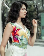 Stylish Telugu Beauty Krithi Shetty in a Multicolor Floral Cut Out Jumpsuit Photos 03