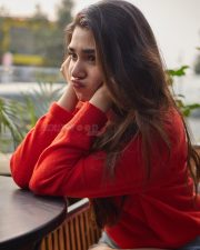 Vaa Vaathiyaar Heroine Krithi Shetty in a Red V Neck Knit Sweater and a High Waisted Light Blue Denim Shorts Photos 06 Vaa Vaathiyaar Heroine Krithi Shetty in a Red V Neck Knit Sweater and a High Waisted Light Blue Denim Shorts Photos 06