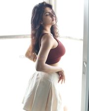 Alluring Actress Misha Narang in a Maroon Crop Top and White Pants Photos 09