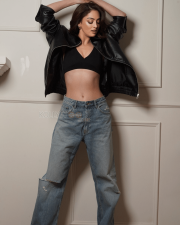 Bold Sandeepa Dhar Cleavage in a Black V Neck Bralette Crop Top With Leather Jacket And Distressed Jeans Photos 04