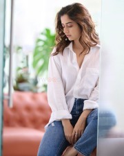 Captivating Ashika Ranganath in a White Shirt and Blue Denim Photos 05