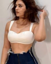 Captivating and Sexy Shraddha Das in a White Bralette with a Dark Blue Denim Mini Skirt Photos 01