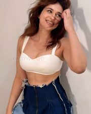 Captivating and Sexy Shraddha Das in a White Bralette with a Dark Blue Denim Mini Skirt Photos 02