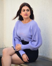 Classy Shraddha Das in a Knitted Lavender Top and Black Mini Skirt Pictures 01